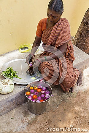 Documentary editorial image. An unidentified Indian woman cooker in the street Editorial Stock Photo