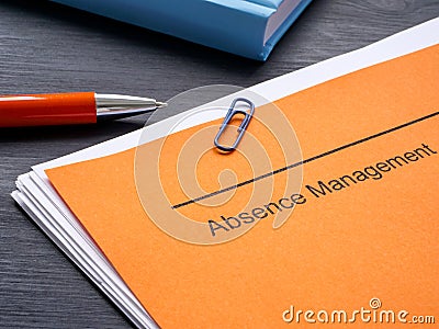 Documents about absence management and notepad. Stock Photo