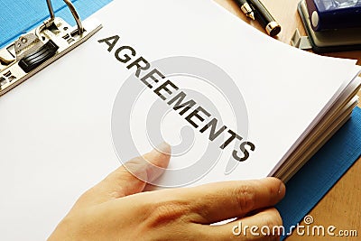 Documents with title Agreements. Stock Photo