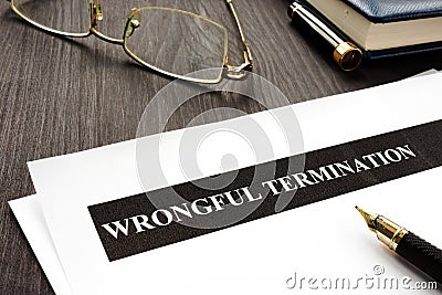 Documents about Wrongful termination on a desk Stock Photo