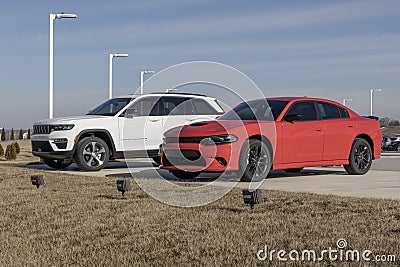 Dodge Charger and Jeep Grand Cherokee dealership display. Dodge and Jeep are part of the Stellantis family of cars and SUVs Editorial Stock Photo