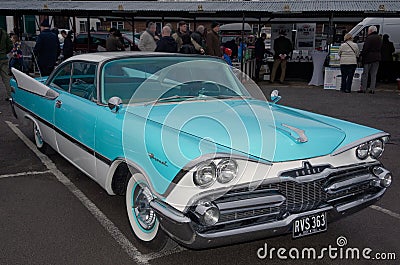 1959 Dodge Coronet coupe in striking two tone turquoise/white livery. Editorial Stock Photo