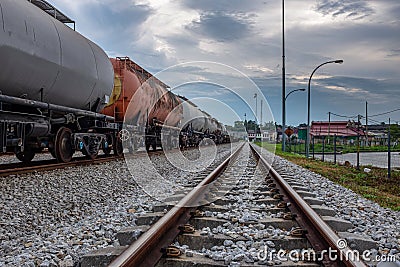 It doesn't matter which side of the tracks your from, the train still rolls the same. Train tracks at Ipoh Stock Photo