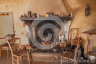 A dog gets hot inside the fireplace Stock Photo