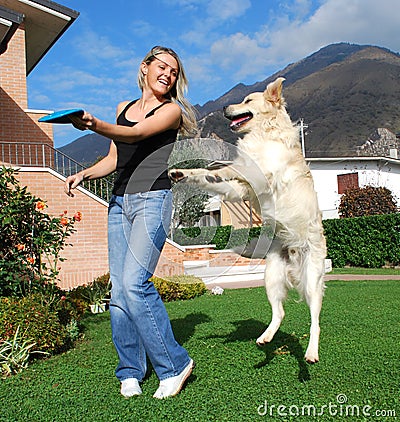 Dog and girl play togheter Stock Photo