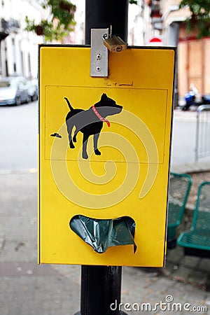 Dog poop bag dispenser Stock Photo