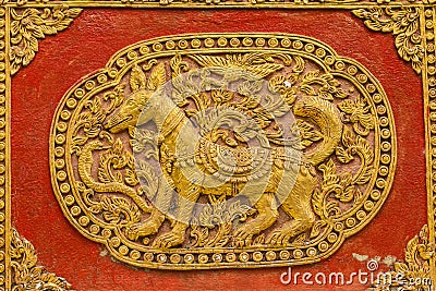 Dog Wall sculpture on Ubosot in Wat Saen Fang , Chiangmai Stock Photo