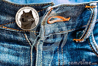 Doge coin instead of buttons on jeans. Editorial Stock Photo