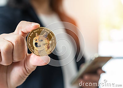 Dogecoin, Doge coin cryptocurrency, digital crypto currency tokens for defi decentralized financial mobile banking p2p Editorial Stock Photo