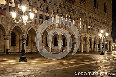 Doges Palace Venice Italy at night with two lamp posts Stock Photo