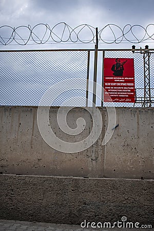 Military security zone, fence, sign, wall, Dogubayazit, Turkey, Middle East, mountain, Iranian border, driving, road Stock Photo