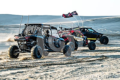 Off road buggy car in the sand dunes of the Qatari desert. Editorial Stock Photo