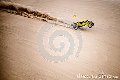 Off road buggy car in the sand dunes of the Qatari desert. Editorial Stock Photo