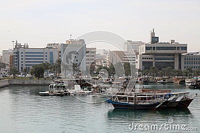 Traditional dhows moored up by Doha corniche Editorial Stock Photo