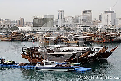 Traditional dhows moored up by Doha corniche Editorial Stock Photo