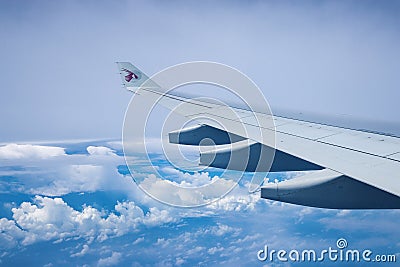 DOHA, QATAR - JUNE 9, 2016: A view of the airplane wing as seen Editorial Stock Photo