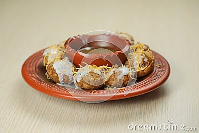 Doi Fuchka or pani puri and gol gappay with sour water, yogurt served in dish isolated on table top view of indian, bangladeshi Stock Photo