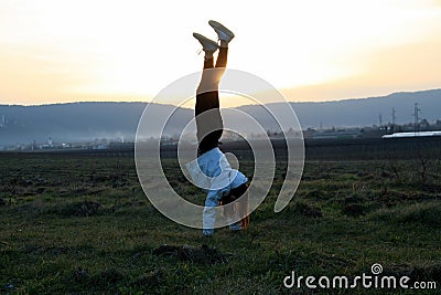 She is doing handstand Stock Photo
