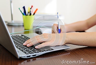 Doing homework on a laptop Stock Photo