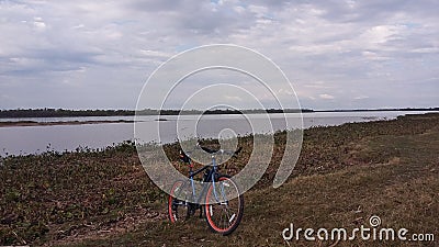 Tourist cycling in nature near rio Editorial Stock Photo