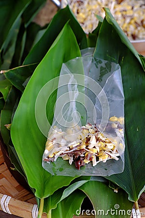 Doing Vietnamese vegetarian dish, make deep fried corn spring roll, vegan food in leaf background Stock Photo