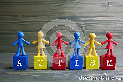 Doll children design with autism word on wooden background Stock Photo