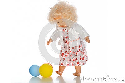 A doll cute little girl in colorful clothes with colorfull balloons Stock Photo