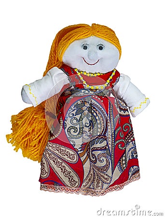 Doll-girl with yellow hair, made of cloth, in a red dress. Home creativity. Traditional Russian doll. Isolated doll on a Stock Photo