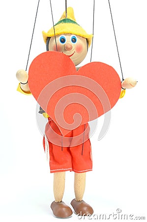 Doll holds heart Stock Photo