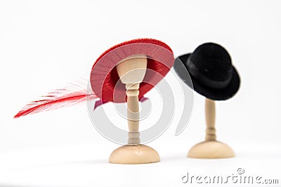 Doll House Mens and Women's Fashion Hats on small hat stands wit Stock Photo