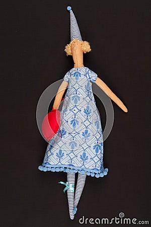 Doll with red bag Stock Photo