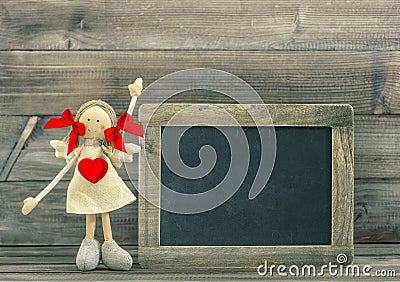 Doll with Red Heart. Valentines Day decoration with blackboard Stock Photo