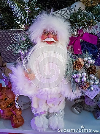 Doll Santa Claus in white with gifts and animals Stock Photo