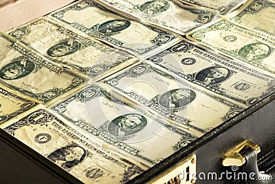 Dollar banknotes packed into a briefcase or bag Stock Photo