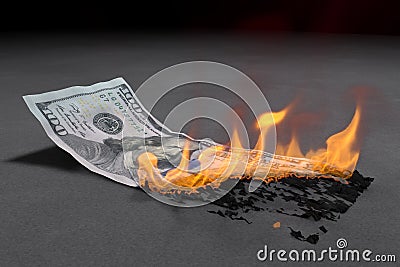 100 Dollar bill is burning bright Stock Photo