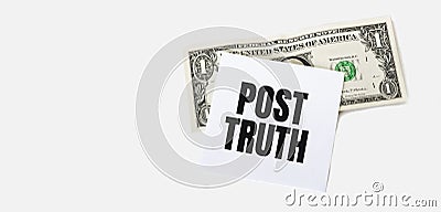 1 dollar bill and white notepad sheet on the white background. POST TRUTH text Stock Photo