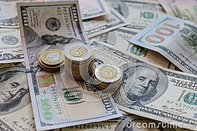 Dollar bills laid out on table. Three different columns of coins, financial crisis, money, finance, savings, salary Stock Photo