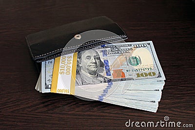 $100 dollar bills stacks - stacks of money on the table Stock Photo