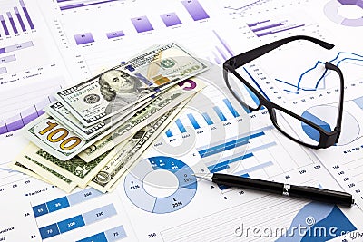 Dollar currency on graphs, financial planning and expense report Stock Photo