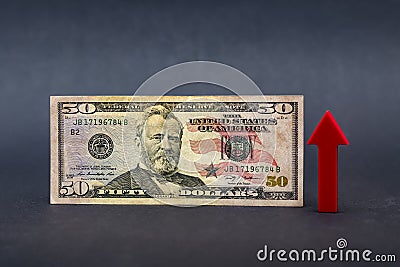 Dollar inflation, dollar depreciation, decline in the purchasing power of the American currency. Copy space. Fifty Stock Photo