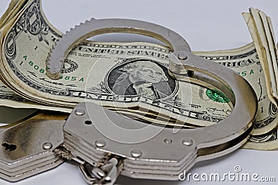Metall handcuffs and money Stock Photo