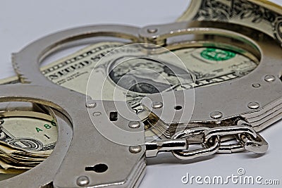 Metall handcuffs and money Stock Photo