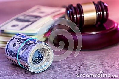 dollar roll and judges hammer. Stock Photo