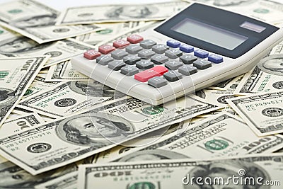 Dollars and calculator with plus red button Stock Photo