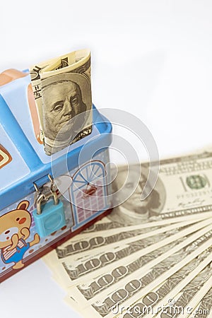 Dollars and piggy bank. Concept picture of saving money. Stock Photo