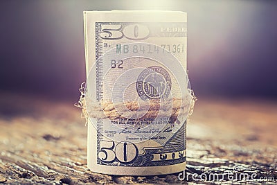 Dollars rolled banknotes closeup. Cash Money American Dollars.Close-up view of stack of US dollars Stock Photo