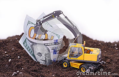 Dollars in the soil. a large expenditure of resources Stock Photo