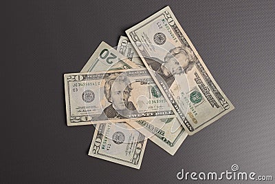 Dollars studio image. Money on deep grey background. Dollar bills. Stock Photo