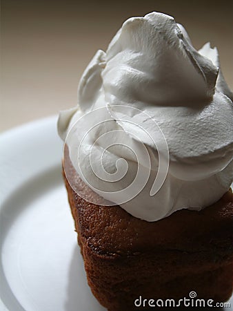Dollop of cream on cake Stock Photo