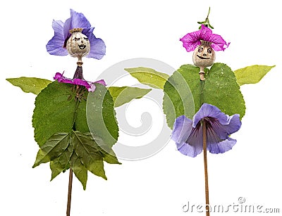 Dolls from poppy head and flowers Stock Photo